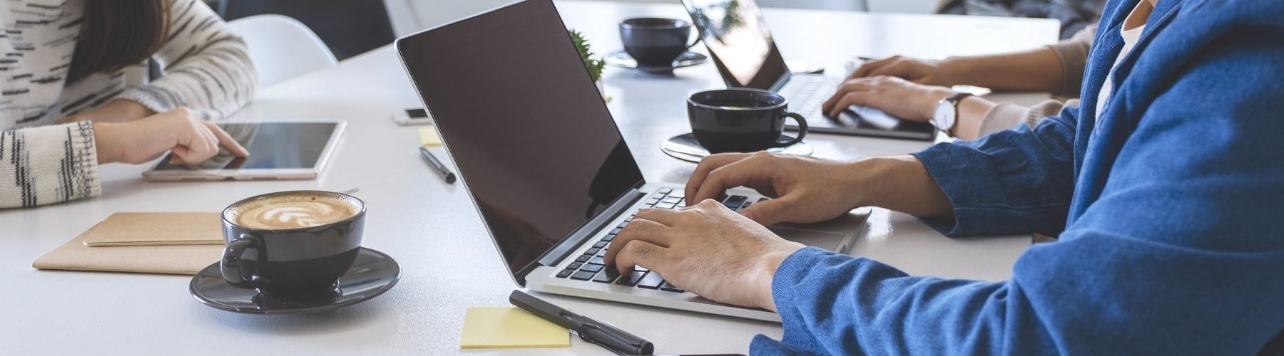 Businesspeople using and working on laptop computer and tablet p About BaryTech